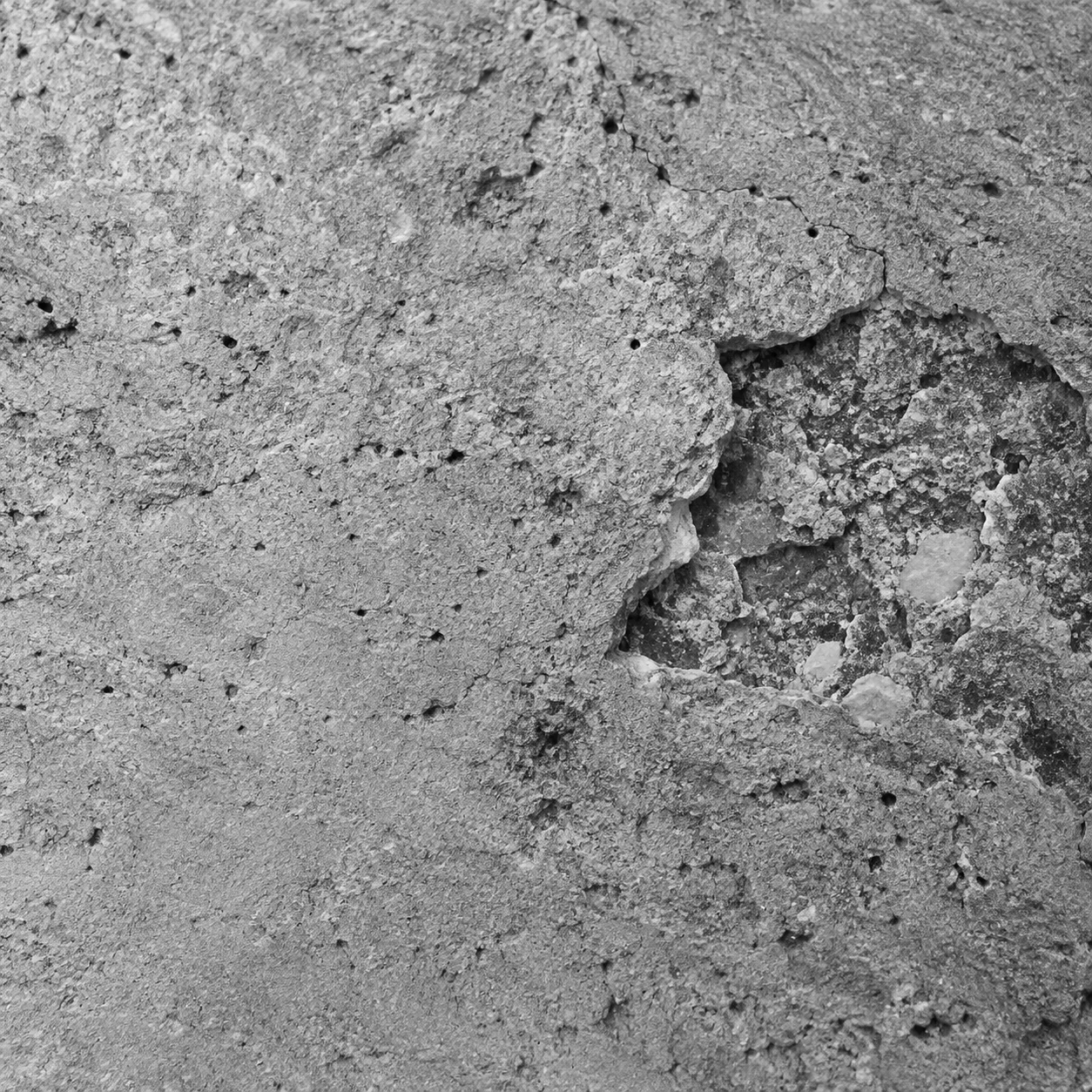 Textura de concreto com uma diferença de superfície destacada pelo enquadramento.